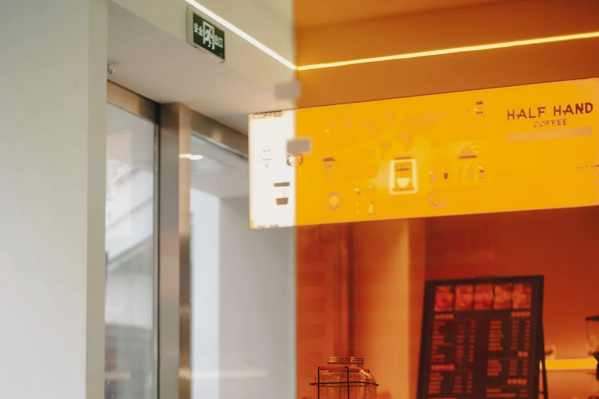 Illustrative category photo of a warmly lit independent coffee shop interior